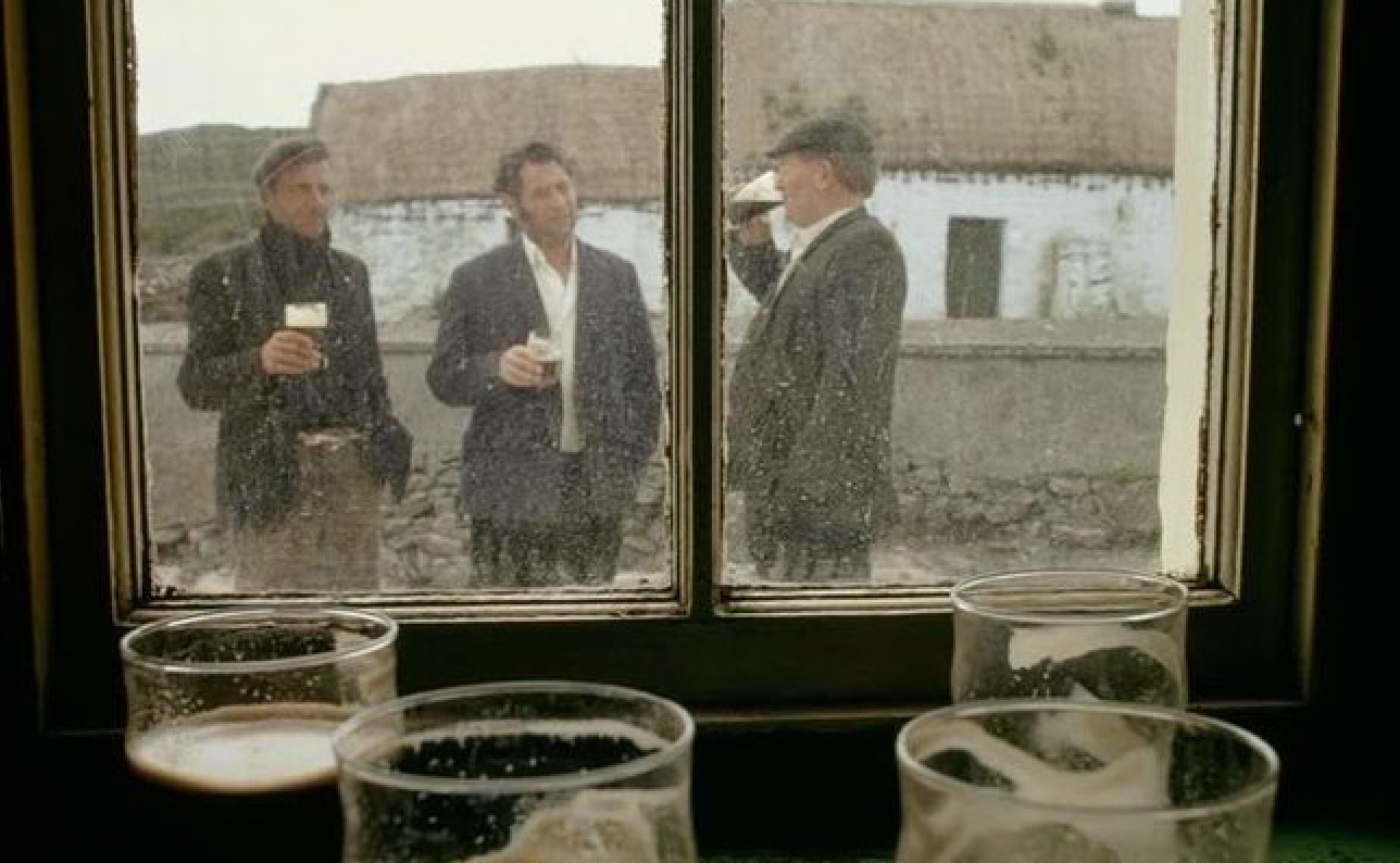 Livestock traders drink outside the only pub on Inis Meáin, off the west coast of Ireland, 1971